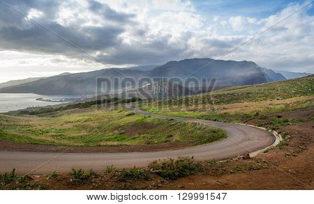 Empty serpentine road from eastern tail of the island to volcanic mountains. Canical, Madeira, Portugal.