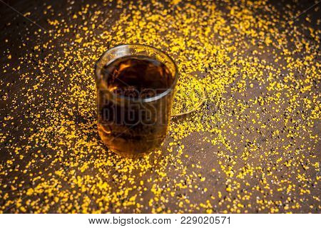 Close Up Of  Extracted Water Of Lal Sarson/brown Mustard  Seeds In A Transparent Glass With Crushed 