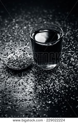 Close Up Of  Extracted Water Of Lal Sarson/brown Mustard  Seeds In A Transparent Glass With Crushed 