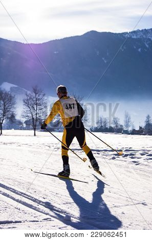 Skier During A Race In The Middle Of Mountains