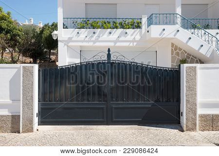 New Dark Metal Double Gates For Entry Of Cars Into The Yard Closed