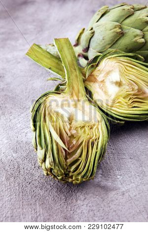 Artichokes On Grey Background. Fresh Organic Artichoke Flower.