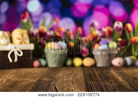 Easter Theme. Easter Eggs. Colorful Tulips. Rustic Wooden Table. Shallow Depth Of Focus. Bokeh Backg