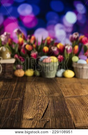 Easter Theme. Easter Eggs. Colorful Tulips. Rustic Wooden Table. Shallow Depth Of Focus. Bokeh Backg