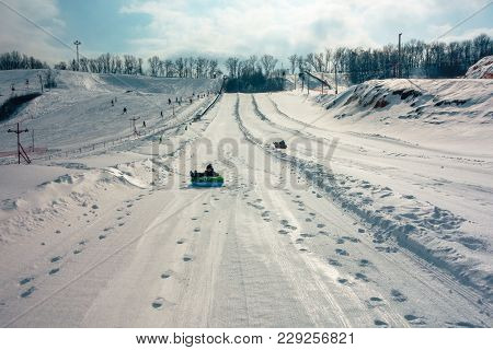 POLTAVA, UKRAINE - MARCH 02, 2018: people descend on the ski slope near Poltava