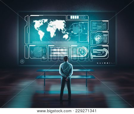 Businessman Working Of A Wall With A Toch Screen And Earth Globe. The Concept Of Working On A Networ