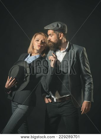 Couple Of Detectives Or Researchers, Private Investigators. Man And Woman In Retro Suit And Hat On D