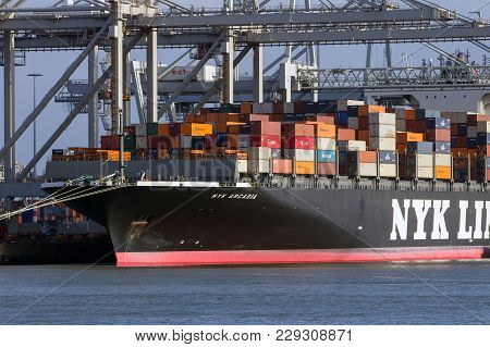Rotterdam, The Netherlands - Jan 13, 2012: Nyk Line Container Ship Loaded By Gantry Cranes At The Ec