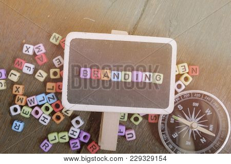 Advertising And Marketing Concept Image, Top View Flat Lay Of Word Block Branding On Signage And Woo