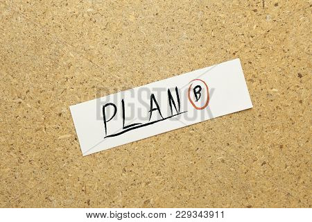 Plan B Text Writeen On Paper On Brown Background