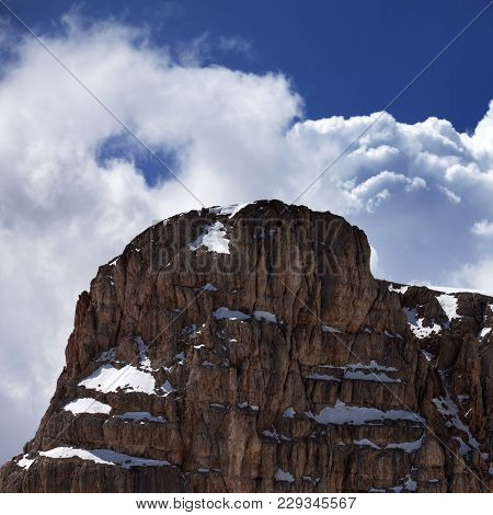 Top of mountain and blue sky with clouds at sun day. Turkey, Central Taurus Mountains, Aladaglar (Anti-Taurus)