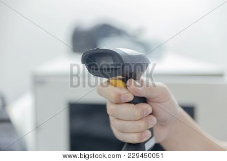 Close Up Of Hand With Bar Code Scanner
