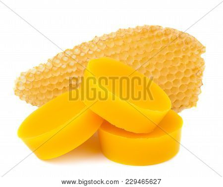 Pieces Of Natural Beeswax And A Piece Of Honey Cell Are Isolated On A White Background. Beekeeping P