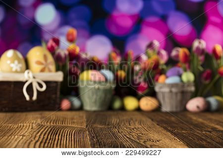 Easter Theme. Easter Eggs. Colorful Tulips. Rustic Wooden Table. Shallow Depth Of Focus. Bokeh Backg