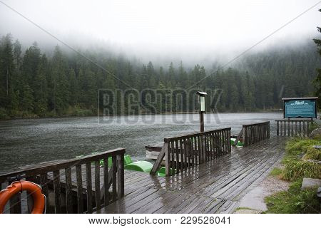 Motion of water of Mummelsee lake while raining in Black Forest or Schwarzwald at Baden-wurttemberg 