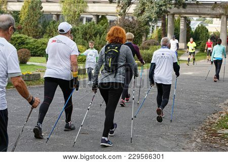 WROCLAW, POLAND - OCTOBER 15, 2017: People in fitness course nordic walking competition in the city park