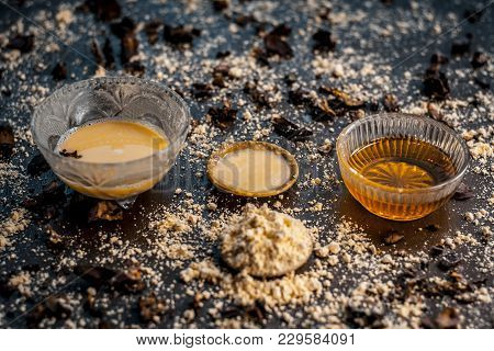 Close Up Of Ingredients Of A  Face Pack Of Chickpea Flour,honey,rose Water,rose Petals On A Wooden S