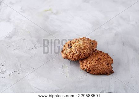 Sweet Cookies With Raisin Arranged In Pile On Light Textured Background, Close-up, Shallow Depth Of 