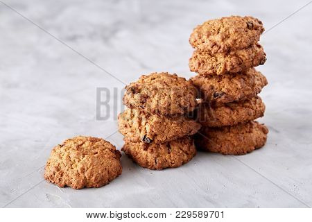 Sweet Cookies With Raisin Arranged In Pile On Light Textured Background, Close-up, Shallow Depth Of 