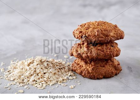 Sweet Cookies With Raisin Arranged In Pile On Light Textured Background, Close-up, Shallow Depth Of 