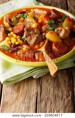 Cachupa Stew With Meat, Chorizo And Vegetables Close-up In A Plate. Vertical
