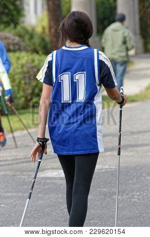 WROCLAW, POLAND - OCTOBER 15, 2017: People in fitness course nordic walking competition in the city park