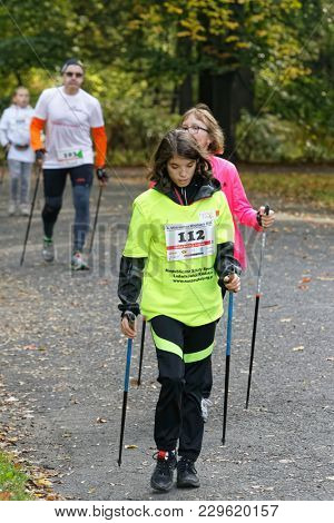 WROCLAW, POLAND - OCTOBER 15, 2017: People in fitness course nordic walking competition in the city park