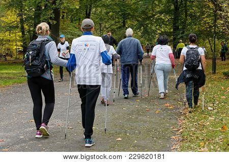 WROCLAW, POLAND - OCTOBER 15, 2017: People in fitness course nordic walking competition in the city park