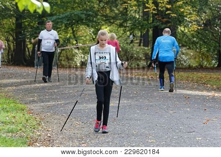 WROCLAW, POLAND - OCTOBER 15, 2017: People in fitness course nordic walking competition in the city park