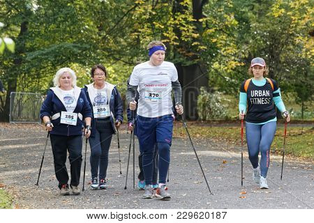 WROCLAW, POLAND - OCTOBER 15, 2017: People in fitness course nordic walking competition in the city park