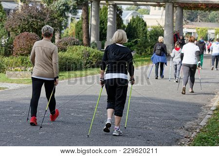 WROCLAW, POLAND - OCTOBER 15, 2017: People in fitness course nordic walking competition in the city park