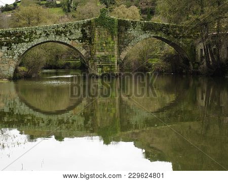 Roman Bridge Over The River Arnoia In Allariz, Galicia. Spain