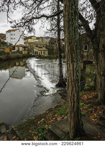 Small Waterfall On The Arnoia River As It Passes Through Allariz, Galicia, Spain