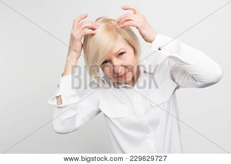 This Woman Has A Problem Of Loosing Hair From Her Head. She Need Some Treatment. Otherwise She Would