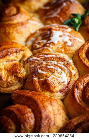 Sweet Buns With Jam And Cream On A Baking Sheet
