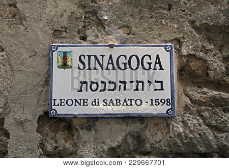 Pitigliano, Italy- July 26, 2017: A Sign Of Jewish Synagogue On A Building Wall In Medieval Village 