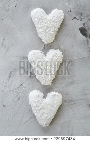 Sweet Crunchy Coconat Heart-shaped Biscuits Arranged In Pattern On Light Textured Background, Top Vi