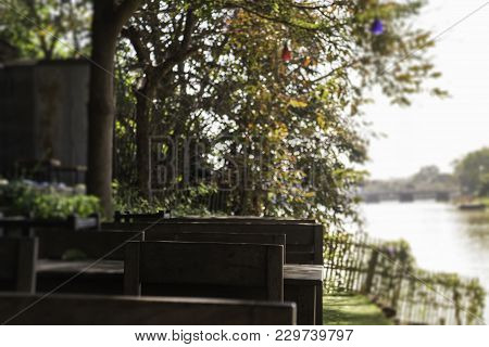 Outdoor Garden With Wooden Set Of Furniture, Stock Photo