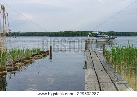 Senftenberg, Germany - May 20, 2017: Boat Mooring And Motor Yacht On The Lake Senftenberger See. Fed