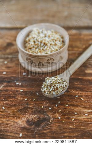 White Sesame Seed, Sesame Seed In Wooden Cup On Natural Wooden Background In Rustic Style