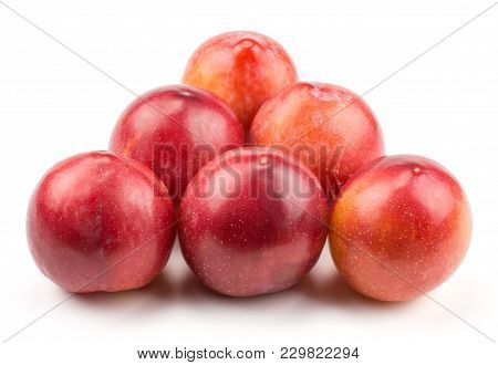 Six Plums Red Orange Isolated On White Background Like Billiard Balls Triangle