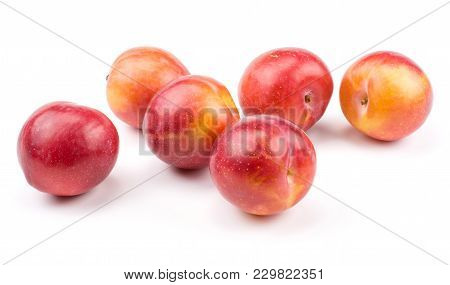 Six Plums Red Orange Stack Isolated On White Background