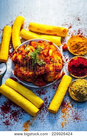 Indian Appetizer Dish I.e.teekha Laal Batata Or Spicy Potato With  All Its Ingredients And Spices On