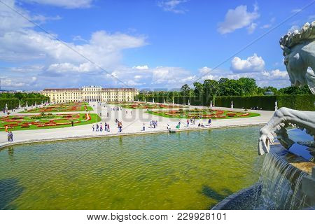 Vienna,austria - September 4 2017; Tourists In Grounds Beyond Large Pond And Horse Statue Of Baroque