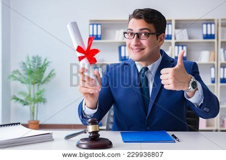 Laywer with diploma roll in legal profession eductional concept