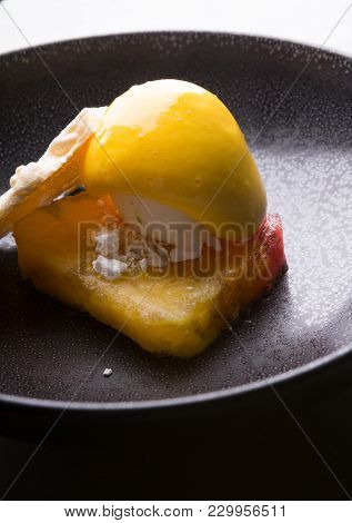 Sorbetto Ice Cream Served On A Black Bowl