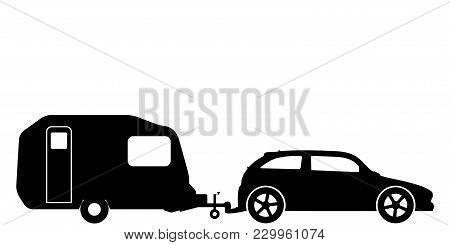 A Silhouette Of A Hatchback Car Towing A Caravan