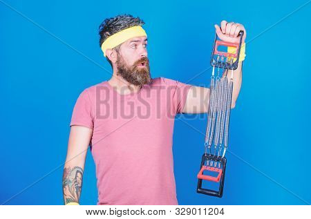 Athlete Sport Instructor. Athlete Workout With Expander. Man Bearded Athlete Exercising With Expande