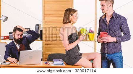 Break During Working Day. Young Managers Talking During Work Break. Business Partners Enjoying Conve