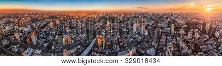 Wide Panoramic View Of Bangkok, Thailand. Cityscape With Skyscrapers At Sunset